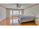 Bedroom with wood-look flooring, a ceiling fan, and a large window at 6 High Sierra Dr, Henderson, NV 89074