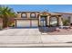 Charming two-story home featuring a three-car garage and inviting front yard with decorative fountain at 6 High Sierra Dr, Henderson, NV 89074