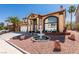 Charming two-story home featuring a three-car garage and inviting front yard with decorative fountain at 6 High Sierra Dr, Henderson, NV 89074