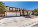 Charming two-story home featuring a three-car garage and inviting front yard with decorative fountain at 6 High Sierra Dr, Henderson, NV 89074