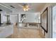 Bright eat-in kitchen features tile floors, granite counters, and an open staircase at 6 High Sierra Dr, Henderson, NV 89074
