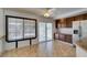 Eat-in kitchen with dark wood cabinetry, stainless steel appliances, and sliding doors to a deck overlooking the pool at 6 High Sierra Dr, Henderson, NV 89074
