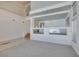 Bright living room boasts an open design, neutral carpeting, and staircase access at 6 High Sierra Dr, Henderson, NV 89074