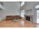 Living room showcases wood floors, fireplace, and glass sliding door to backyard pool at 6 High Sierra Dr, Henderson, NV 89074