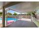 Wide patio deck provides ample room for entertaining, featuring safety railings, and views of the pool and landscape at 6 High Sierra Dr, Henderson, NV 89074