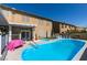 Backyard pool and patio area features a heated pool, an in-ground spa, and lounge seating for relaxation at 6 High Sierra Dr, Henderson, NV 89074