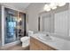 A bathroom featuring an updated walk-in shower, vanity, toilet, and neutral walls at 6480 Annie Oakley Dr # 112, Las Vegas, NV 89120
