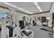 Community gym featuring various exercise equipment, bright lighting, and serene views of the outdoors at 6480 Annie Oakley Dr # 112, Las Vegas, NV 89120
