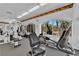 Well-equipped fitness center with modern exercise machines and natural light from large arched windows at 6480 Annie Oakley Dr # 112, Las Vegas, NV 89120