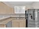 Modern kitchen featuring stainless steel appliances, a double sink, and bright lighting at 6480 Annie Oakley Dr # 112, Las Vegas, NV 89120