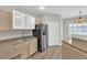 Kitchen featuring stainless steel appliances, a double sink, ample counter space, and bright lighting at 6480 Annie Oakley Dr # 112, Las Vegas, NV 89120