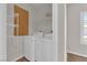 Laundry area with full size washer and dryer and wire shelving at 6480 Annie Oakley Dr # 112, Las Vegas, NV 89120