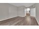 Neutral main bedroom with a bathroom entrance and wood flooring at 6480 Annie Oakley Dr # 112, Las Vegas, NV 89120