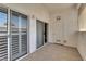 Covered patio with sliding glass doors and storage space offers an intimate outdoor living area at 6480 Annie Oakley Dr # 112, Las Vegas, NV 89120