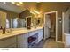 Spacious bathroom with double sinks, vanity, and tile floors at 6712 Tattler Dr, North Las Vegas, NV 89084