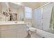 Bright bathroom featuring a shower over tub and a large mirror above the vanity at 6712 Tattler Dr, North Las Vegas, NV 89084