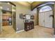 Inviting entryway featuring tile floors, an arched ceiling, and a decorative console table at 6712 Tattler Dr, North Las Vegas, NV 89084