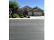 Charming single-story home with desert landscaping, arched entry, and a two-car garage at 6712 Tattler Dr, North Las Vegas, NV 89084