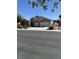 Inviting single-story home with stucco exterior, a two-car garage, and manicured desert landscaping at 6712 Tattler Dr, North Las Vegas, NV 89084