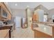 Well-lit kitchen with stainless steel appliances, ample counter space, and access to the laundry room at 6712 Tattler Dr, North Las Vegas, NV 89084