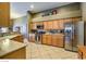 Spacious kitchen featuring stainless steel appliances, ample counter space and tile floors at 6712 Tattler Dr, North Las Vegas, NV 89084