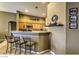 An eat-in kitchen bar and tile floors, perfect for relaxation and entertaining at 6712 Tattler Dr, North Las Vegas, NV 89084
