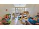 Spacious living area filled with various toys and furnishings, creating a playful atmosphere at 6712 Tattler Dr, North Las Vegas, NV 89084