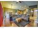 Inviting living room with hardwood floors, a comfortable sectional sofa, and an open layout at 6712 Tattler Dr, North Las Vegas, NV 89084