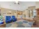 Open-concept living room with hardwood floors and comfortable seating, leading to the kitchen at 6712 Tattler Dr, North Las Vegas, NV 89084