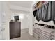 Organized basement featuring shelving with stored items and an open space, ideal for storage or conversion at 6739 Quapaw St, Las Vegas, NV 89149