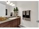 Well-lit bathroom with granite countertop and stylish decor at 6739 Quapaw St, Las Vegas, NV 89149