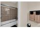 Bathroom featuring modern fixtures and shower-tub with sliding glass door at 6739 Quapaw St, Las Vegas, NV 89149