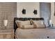 Well-designed bedroom featuring a plush headboard, sconce lighting, and neutral decor at 6739 Quapaw St, Las Vegas, NV 89149