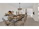 Formal dining room featuring a table set for a dinner party, under a chandelier at 6739 Quapaw St, Las Vegas, NV 89149