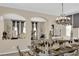 Formal dining area with chandelier and decor, perfect for entertaining guests in luxury at 6739 Quapaw St, Las Vegas, NV 89149