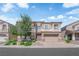 Charming two-story home featuring well-manicured landscaping and a brick driveway at 6739 Quapaw St, Las Vegas, NV 89149