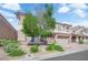 Beautiful two-story home featuring a charming stone accent and a brick driveway at 6739 Quapaw St, Las Vegas, NV 89149