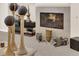 A cozy fireplace is decorated with unique decor, with fire burning adding warmth to the living space at 6739 Quapaw St, Las Vegas, NV 89149