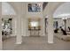 An open-concept foyer boasts high ceilings, columns and views into multiple living spaces at 6739 Quapaw St, Las Vegas, NV 89149
