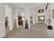 Spacious foyer featuring arched entryways, neutral tones, and decorative art pieces at 6739 Quapaw St, Las Vegas, NV 89149
