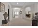 Inviting foyer with arched entryways, neutral tones, and tile flooring at 6739 Quapaw St, Las Vegas, NV 89149
