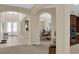 Spacious foyer leading to dining room featuring tile flooring and elegant archways throughout at 6739 Quapaw St, Las Vegas, NV 89149
