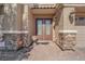 Inviting home entrance with double doors and stone accents at 6739 Quapaw St, Las Vegas, NV 89149