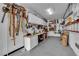 Organized garage space features shelving, storage cabinets, and ample room for projects and tools at 6739 Quapaw St, Las Vegas, NV 89149
