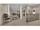 Inviting upstairs hallway featuring neutral tones and decorative wrought iron railings at 6739 Quapaw St, Las Vegas, NV 89149