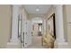 Elegant hallway with decorative columns, an art display table, and stylish doorway design at 6739 Quapaw St, Las Vegas, NV 89149