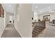 Spacious hallway upstairs with iron railing, leading to multiple rooms and a living area at 6739 Quapaw St, Las Vegas, NV 89149