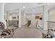 Open hallway with wrought iron railing, leading to various rooms with neutral paint at 6739 Quapaw St, Las Vegas, NV 89149