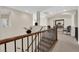 Elegant hallway featuring beautiful railings, arches, and neutral tones at 6739 Quapaw St, Las Vegas, NV 89149