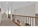 Bright hallway with decorative railings and natural light, connecting different areas of the home at 6739 Quapaw St, Las Vegas, NV 89149